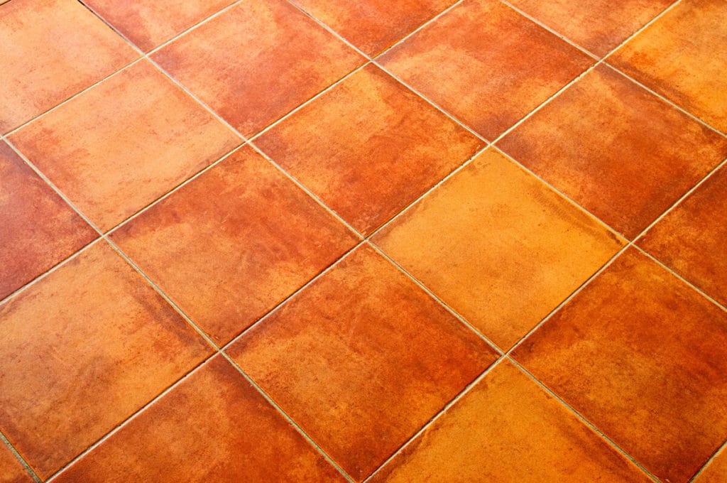 Orange / Red tiles - How to remove paint from tile and grout.